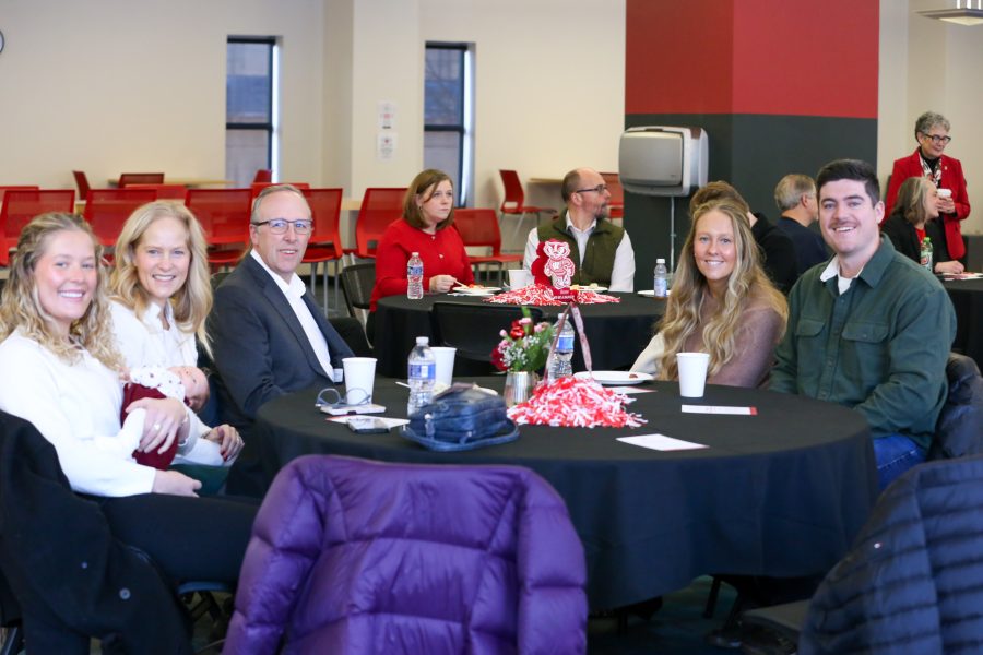 A BSN@Home graduate and their supporters celebrate at the School of Nursing Winter Graduation Celebration, December 2025.